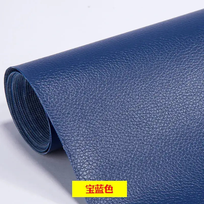 A roll of deep blue faux leather with a textured, pebbled surface.