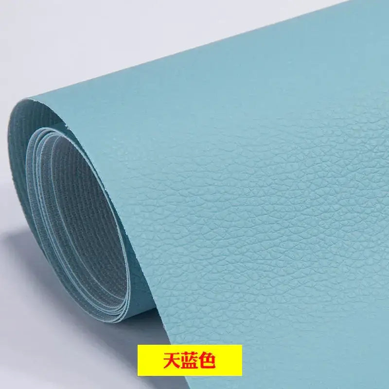 A roll of light blue faux leather with a textured surface.