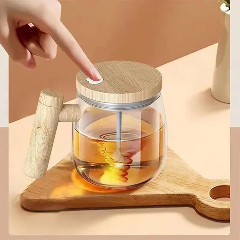 Clear glass honey jar with a wooden lid and handle, filled with golden amber honey.