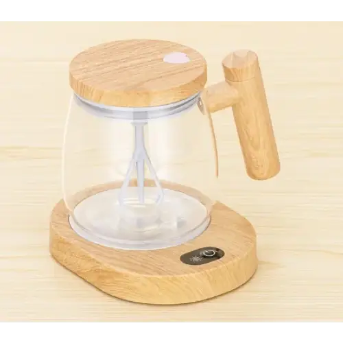 Wooden base electric immersion blender with clear glass jar and bamboo handle.