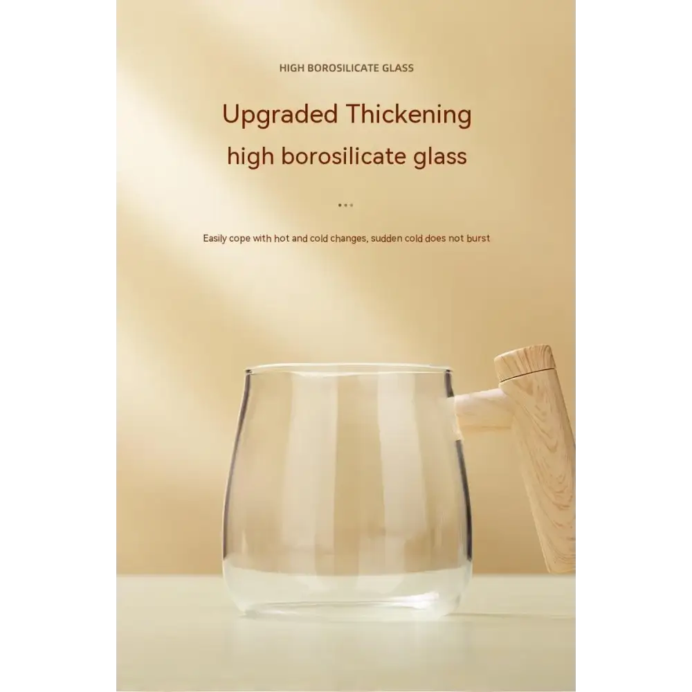 Clear glass mug with a wooden handle.