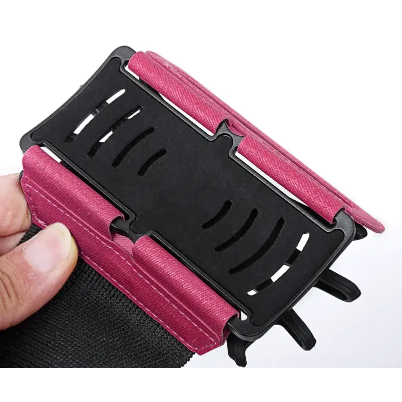 Pink fabric-wrapped phone holster with black plastic clip and adjustable strap.