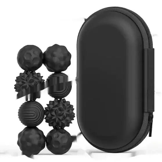 Black textured massage ball set in sleek black carrying case