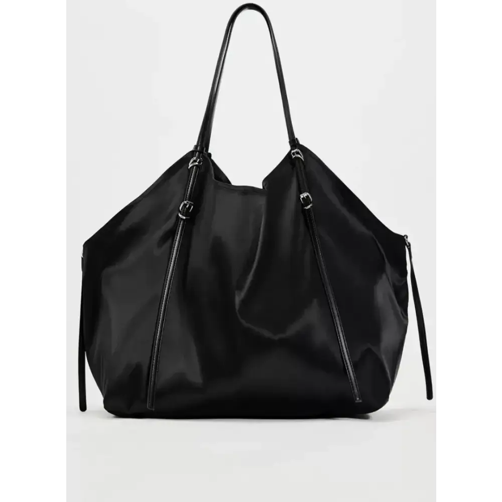 Black nylon tote bag with sleek, minimalist design and matching black leather handles.