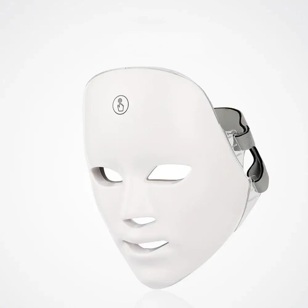 White led facial mask with a sleek, smooth surface and adjustable silver headband.