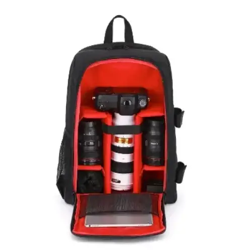 Black camera backpack with red interior, designed to hold a dslr camera and multiple lenses.