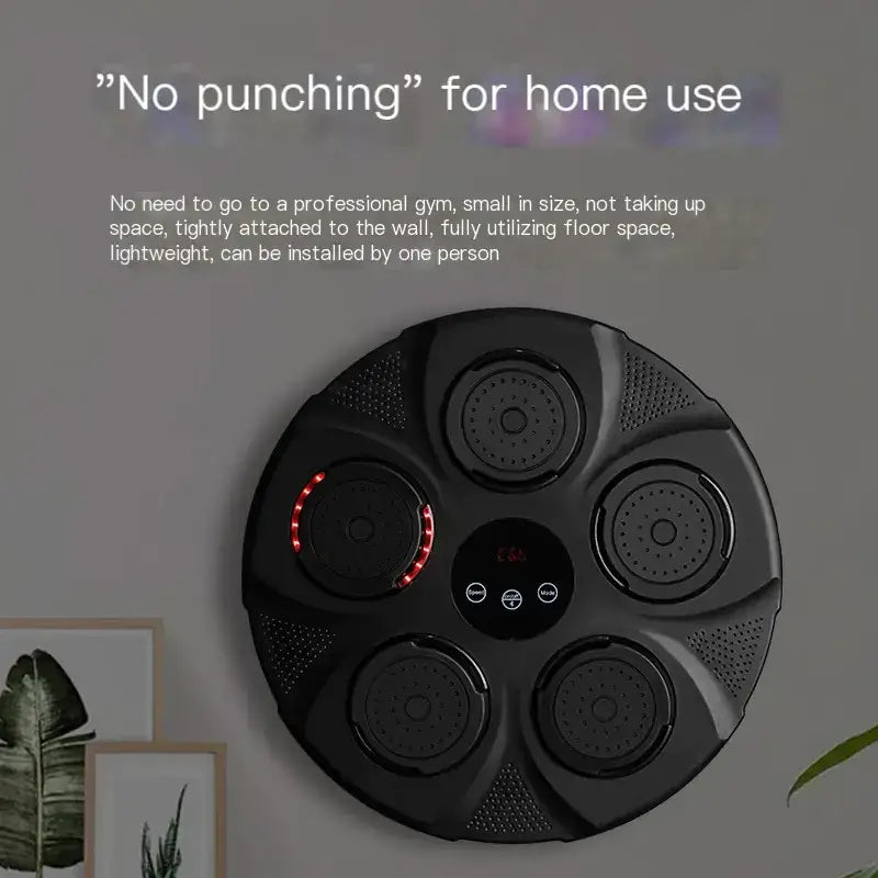 Black circular home fitness device with five speaker-like chambers and a central control panel.