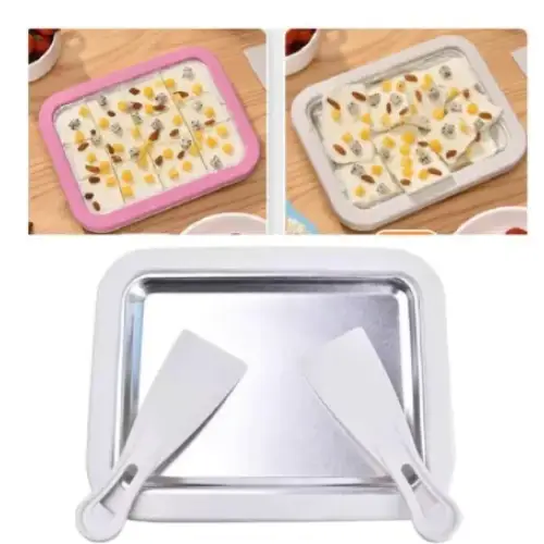 Silver rectangular ice cream making tray with two white plastic spatulas