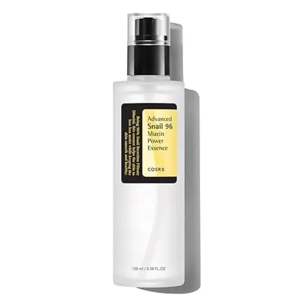 Clear glass bottle with black and yellow label, featuring a silver spray nozzle.