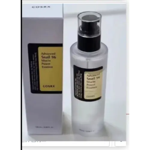 Clear glass bottle with black spray nozzle and gold label, containing a transparent liquid.