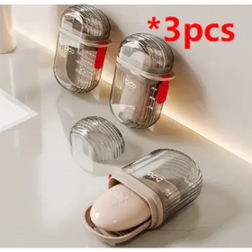 Transparent, ribbed plastic soap dish with a beige silicone insert and red accent clip.