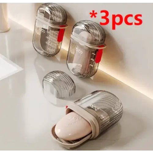 Transparent, ribbed plastic soap dish with a beige silicone insert and red accent clip.