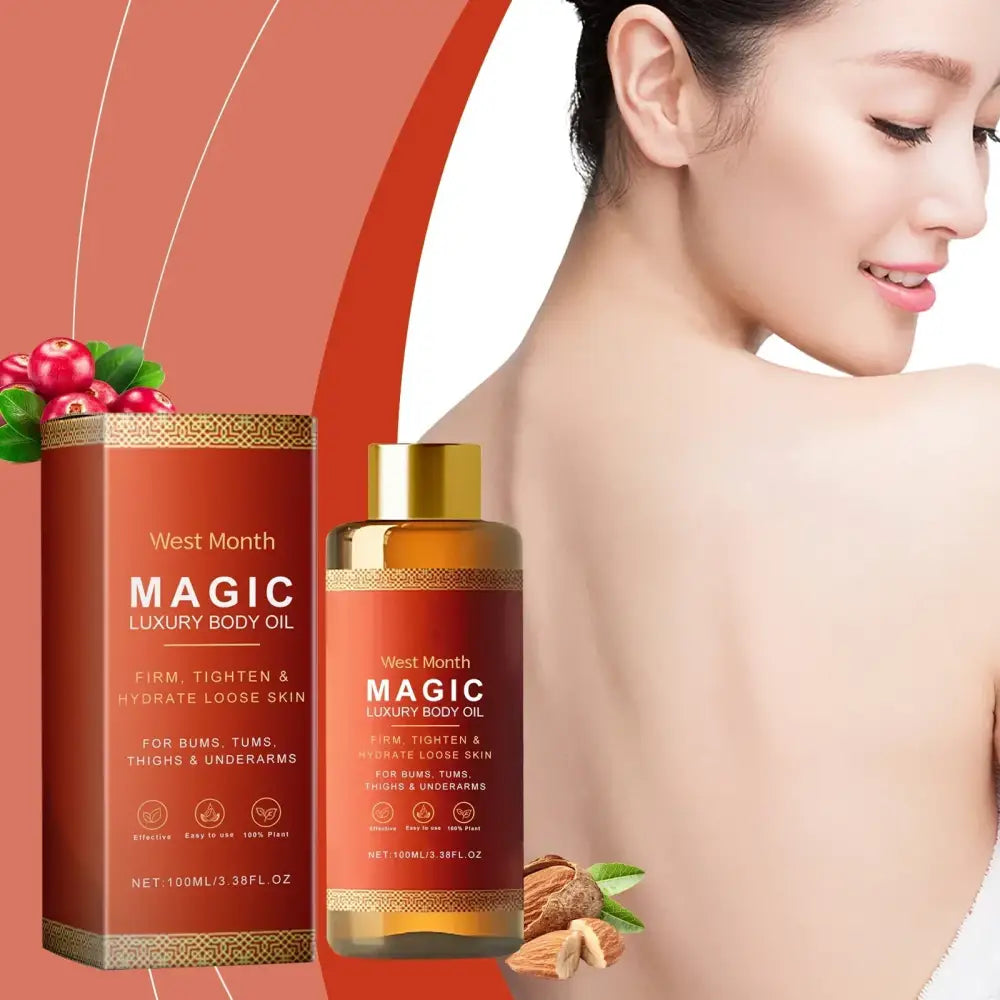 West month magic luxury body oil in a sleek amber glass bottle with gold cap and matching red box, featuring botanical accents of cranberries and almonds.