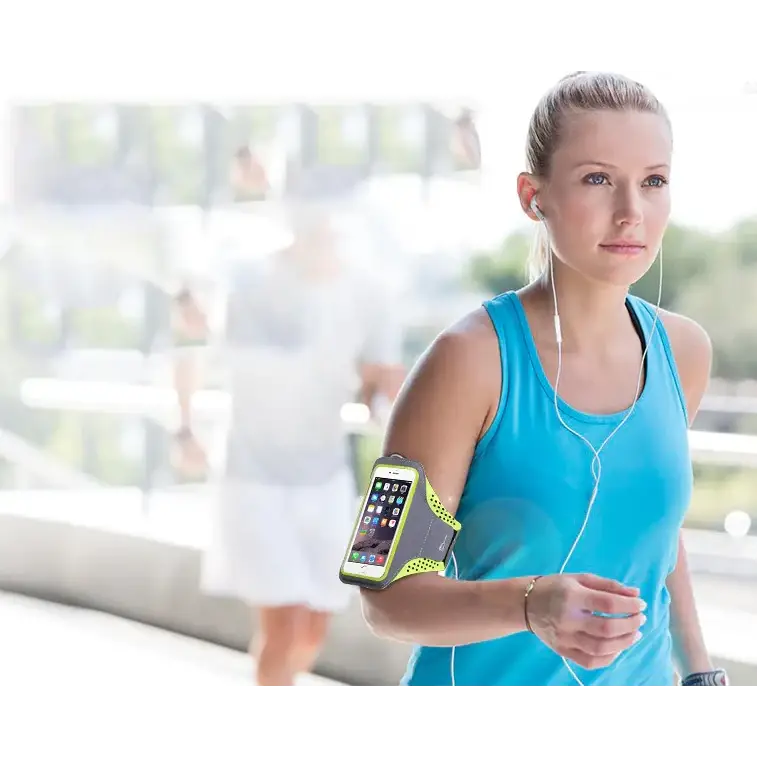 Bright neon yellow and black athletic armband holding a smartphone.