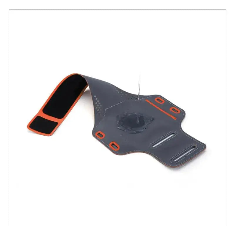 Dark gray and orange sport armband with perforated design, adjustable strap, and multiple compartments for phone storage.