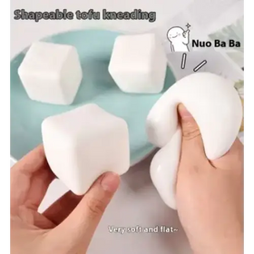 White, soft and squishy tofu-shaped stress-relief cubes.