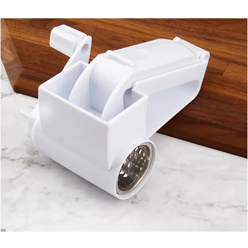 White plastic hand-crank cheese grater with a stainless steel grinding wheel.