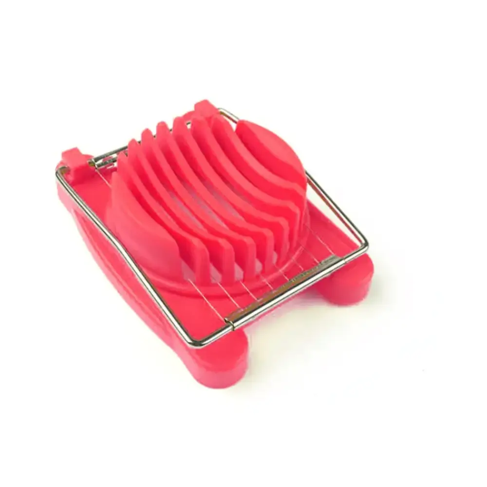 Bright red plastic egg slicer with a metal frame and multiple slicing blades.