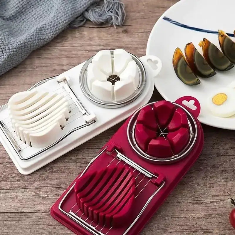 Red and white egg slicer with a heart-shaped handle.