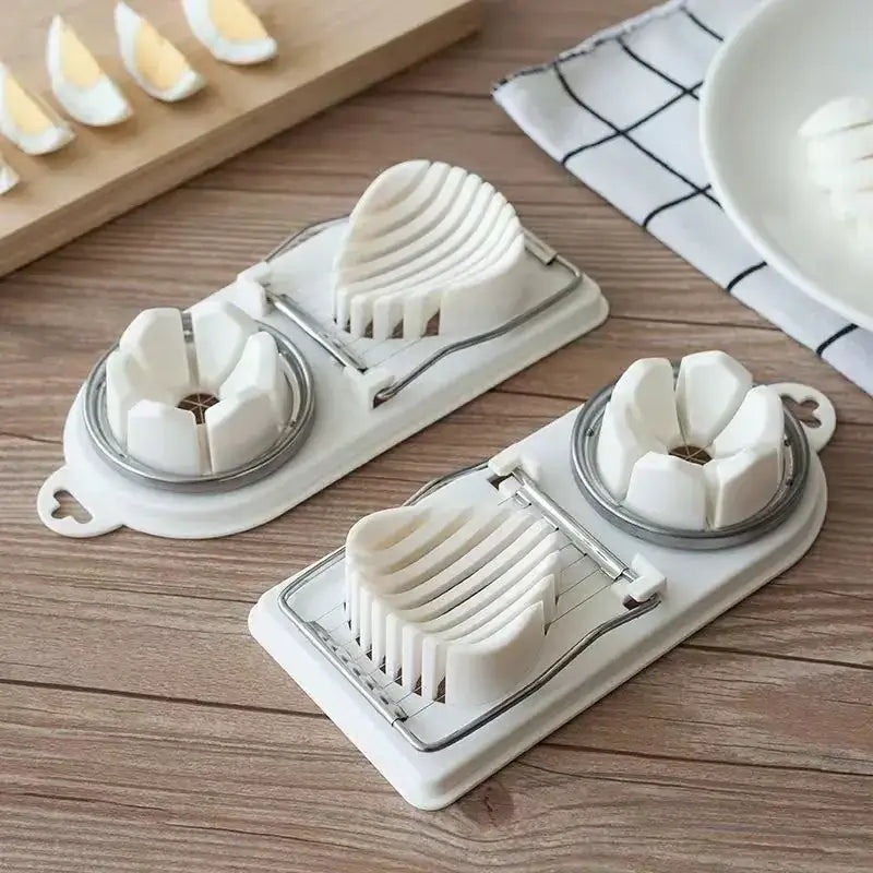 White plastic egg slicer with a silver metal blade and handle, designed for cleanly cutting eggs into uniform slices.