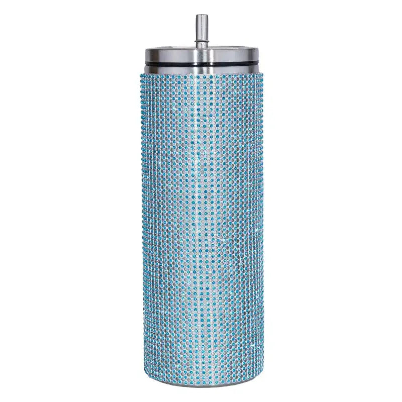 A tall, cylindrical light blue tumbler adorned with a dense pattern of sparkling rhinestones and featuring a sleek silver lid.