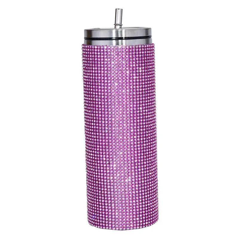 A sparkling purple rhinestone-encrusted insulated tumbler with a stainless steel lid and straw.