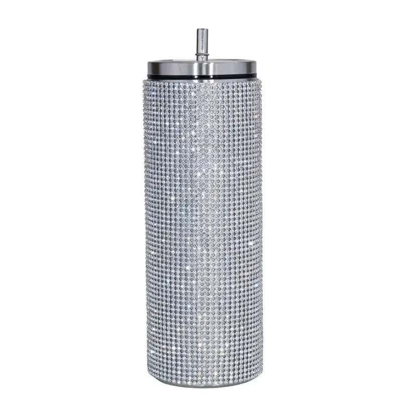 Silver rhinestone-encrusted tumbler with a stainless steel lid and straw.