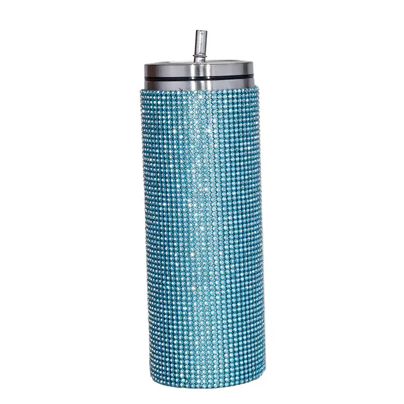 A turquoise rhinestone-encrusted stainless steel tumbler with a silver lid and straw.