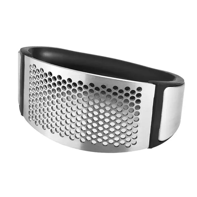 Stainless steel garlic press with a black rubberized grip and evenly spaced circular perforations.
