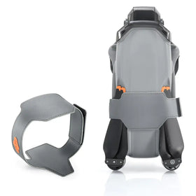 Gray leather drone carrying case with orange accent details and a matching strap.