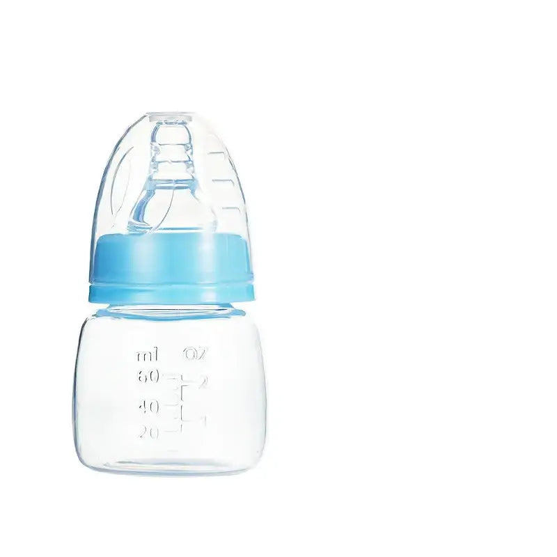 Clear plastic baby bottle with a light blue silicone nipple and matching cap, featuring measurement markings in ml and oz.