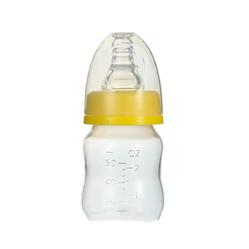 Clear glass baby bottle with a yellow plastic ring and transparent silicone nipple.