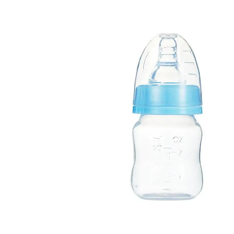Clear plastic baby bottle with a light blue screw-on cap and matching nipple cover.