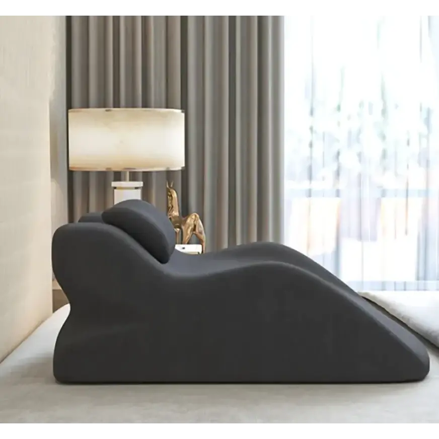 Black ergonomic recliner with smooth, contoured design and plush fabric upholstery.