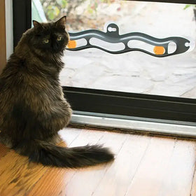 Black and orange wavy cat toy with two spherical ends