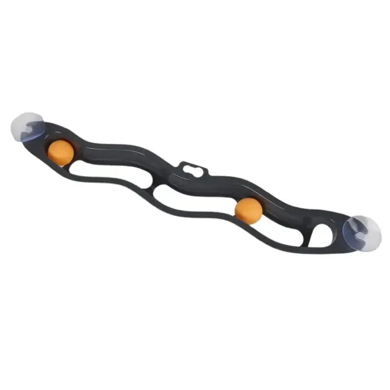 Black plastic hand exerciser with two orange spherical balls and clear suction cups at each end.