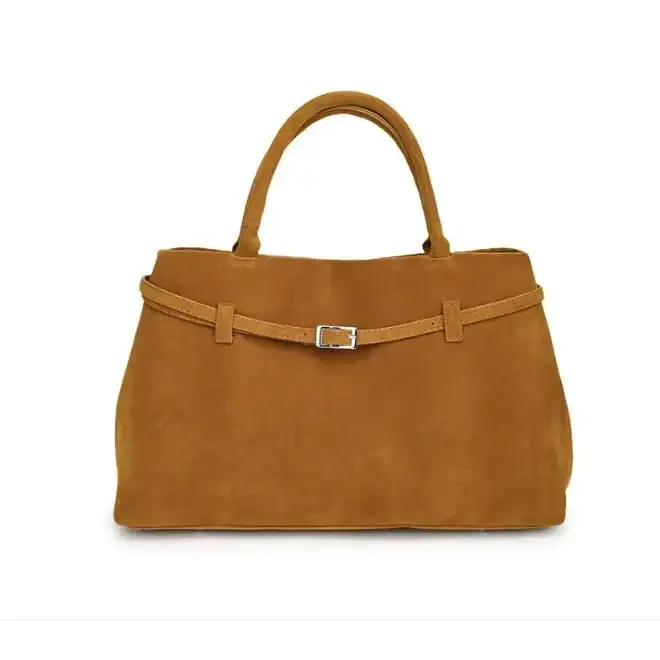 A tan suede tote bag with a matching belt strap and silver buckle.