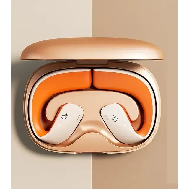 Glossy rose gold wireless earbuds nestled in a matching charging case with vibrant orange interior lining.