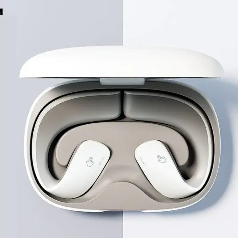 White wireless earbuds nestled in a sleek, minimalist charging case with soft-touch finish.