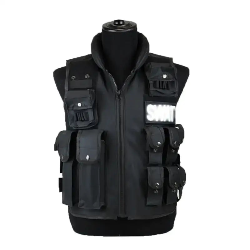Black tactical vest with multiple pockets and a reflective ’smt’ patch on the chest.