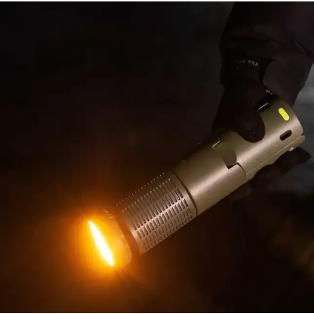A sleek, metallic gold flashlight with a textured grip and an orange beam of light emanating from its front.