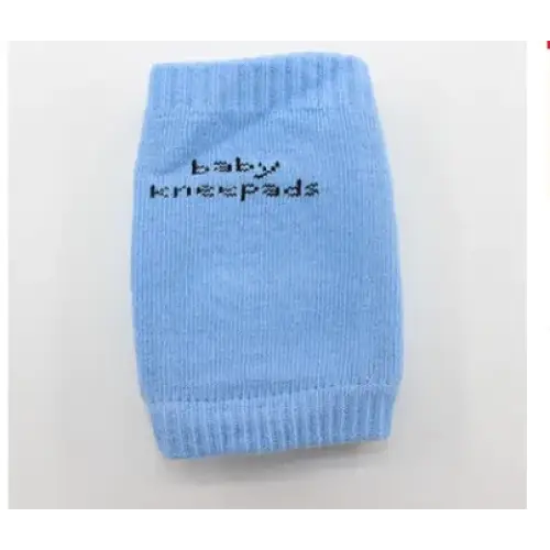 Light blue knitted baby knee pads with ’baby kneepads’ embroidered in black.
