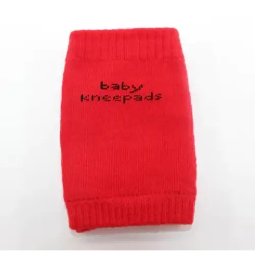 Red knitted baby knee pads with black embroidered text.