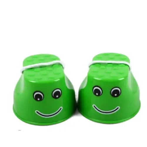 Green plastic cups with smiling faces and black eyes, tied together by a white rubber band.