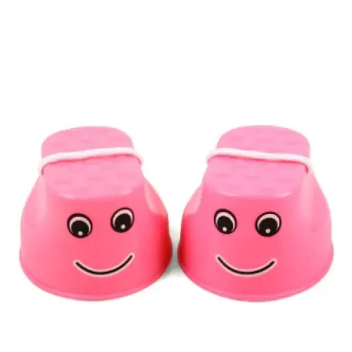 Pink plastic children’s step stools with cartoon faces and white rope handles.