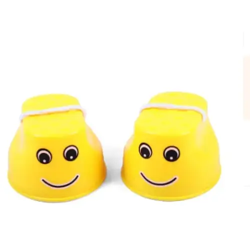 Bright yellow plastic cups with smiling face designs and white string tied around their tops.