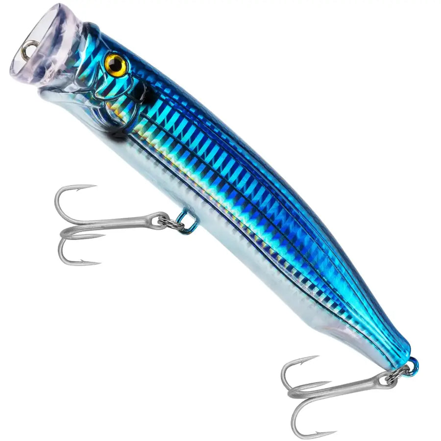 Blue and silver metallic popper fishing lure with a yellow eye.