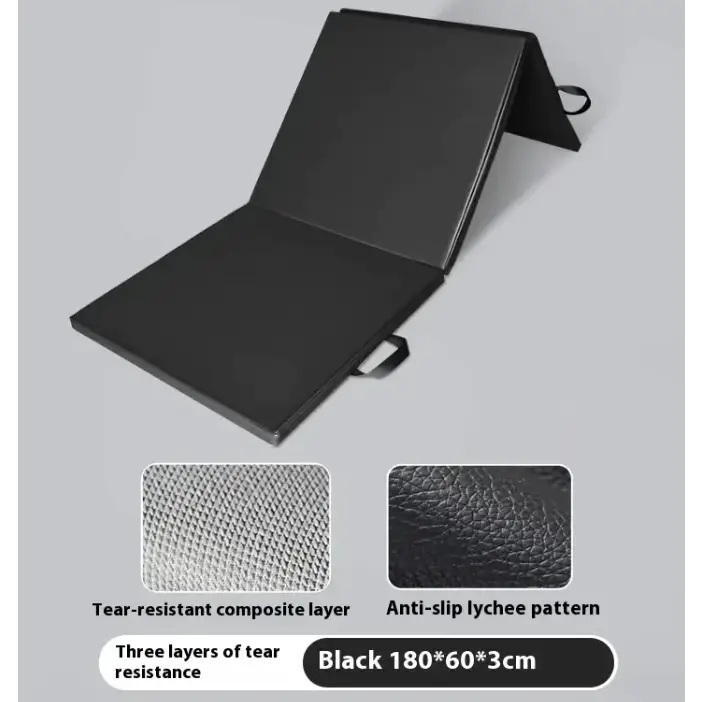 Black foldable exercise mat with a tear-resistant composite layer and anti-slip lychee pattern surface.