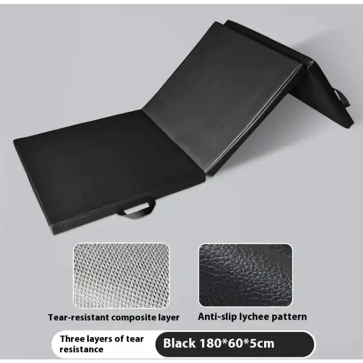 Black foldable exercise mat with a tear-resistant composite layer and anti-slip lychee pattern surface.
