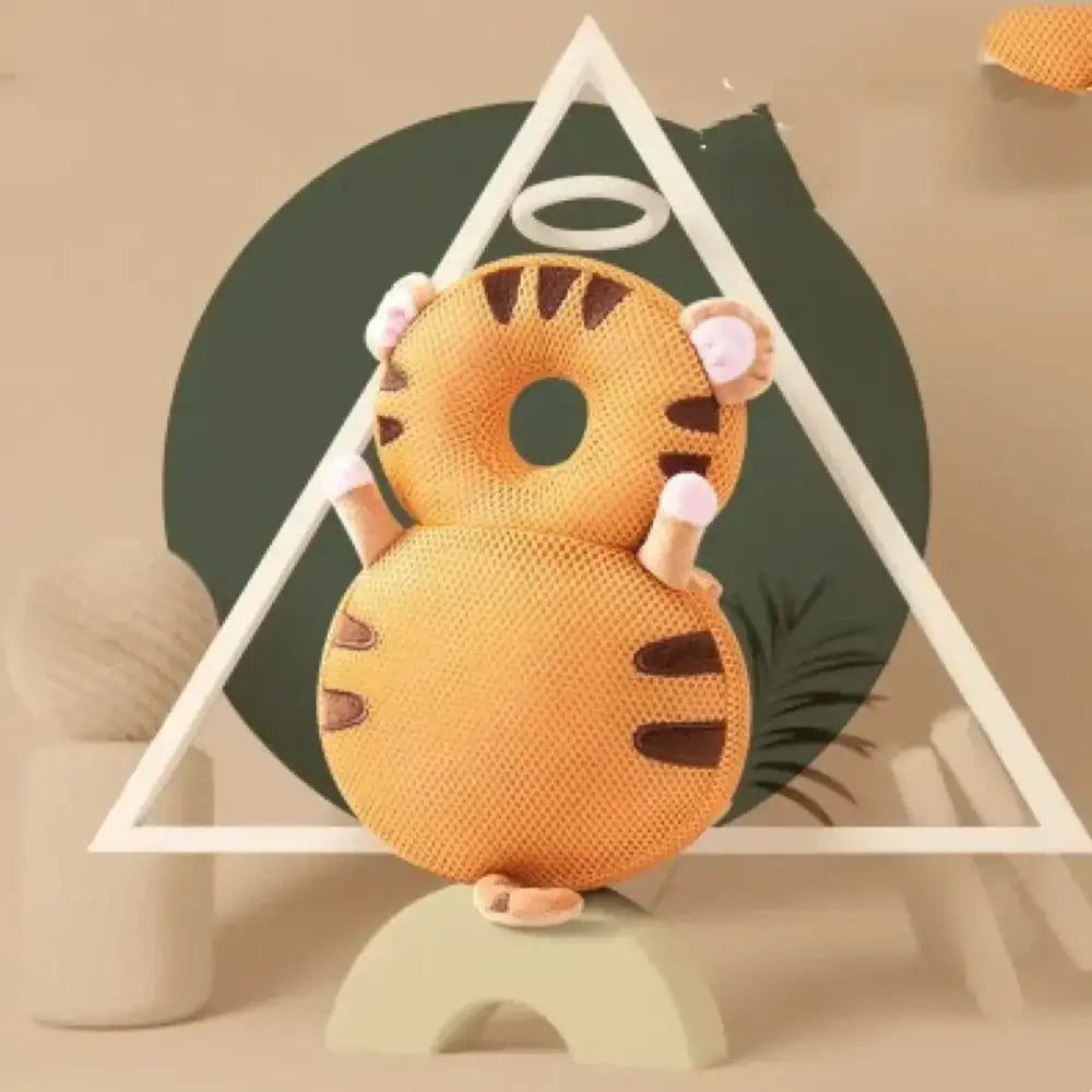 Orange tiger-shaped donut cushion with brown stripes and pink paw details.